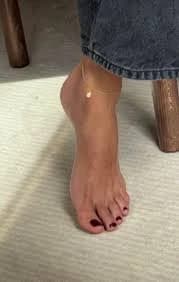 Close-up focus on toes and nails, polished and neat, high resolution female foot fetish shot